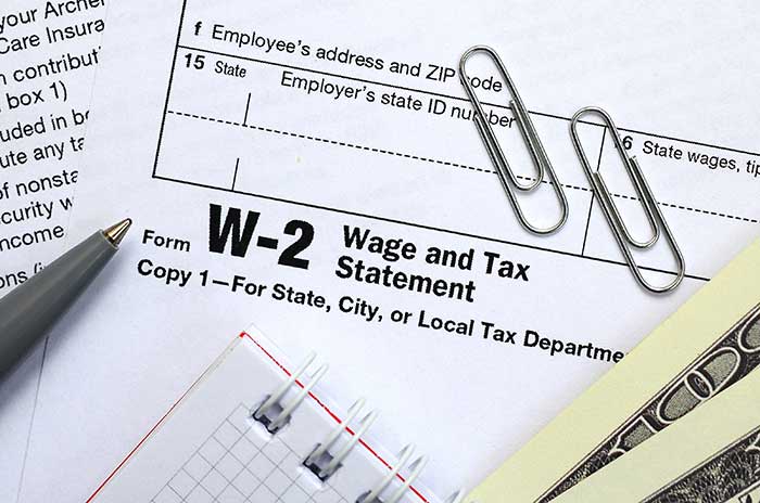 desk showing tax preparation forms